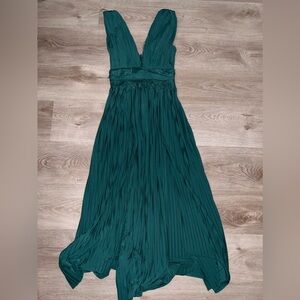 Green dress with a slit on one side. Heavy like material. Size US 2.